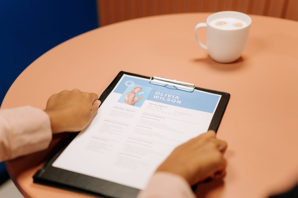 clip board with cv attached on table