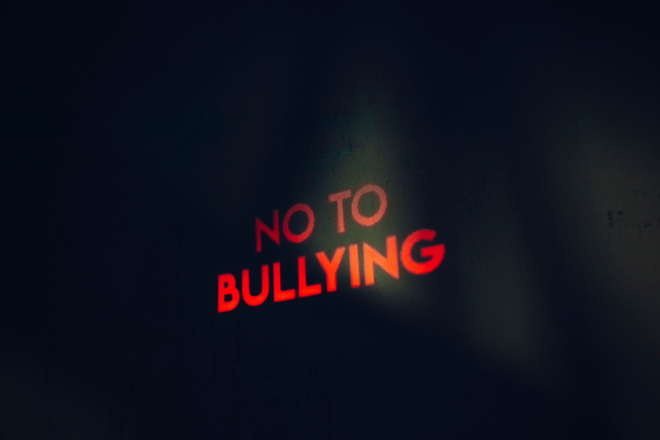 Bullying written in red across black background