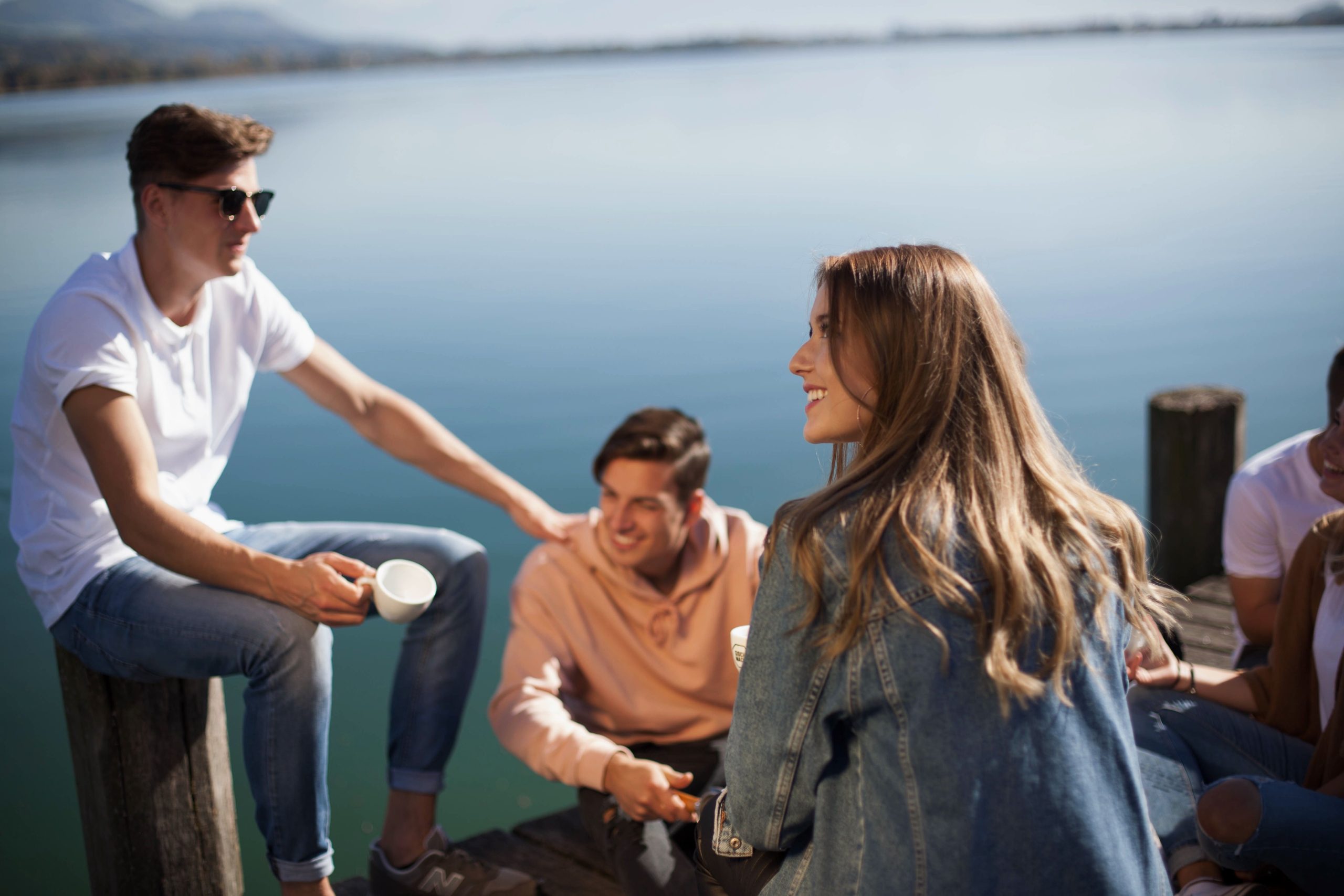 friends gathering at the end of a dock