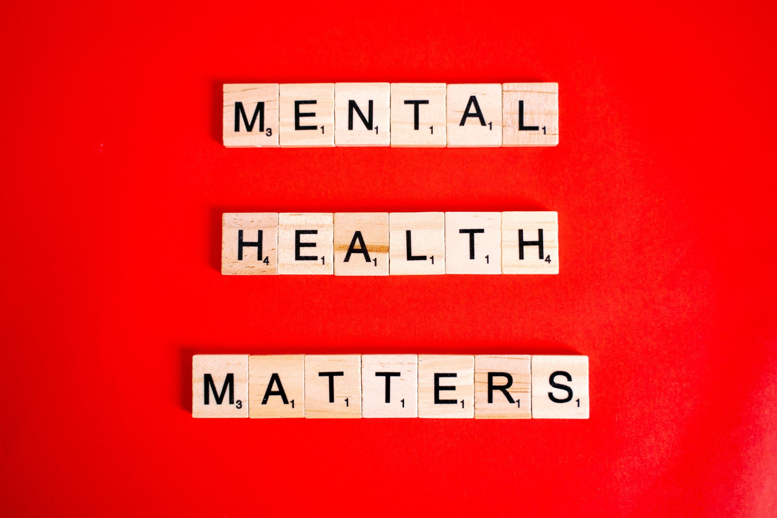 mental health matters spelled out with trivial pursuit letters and red background