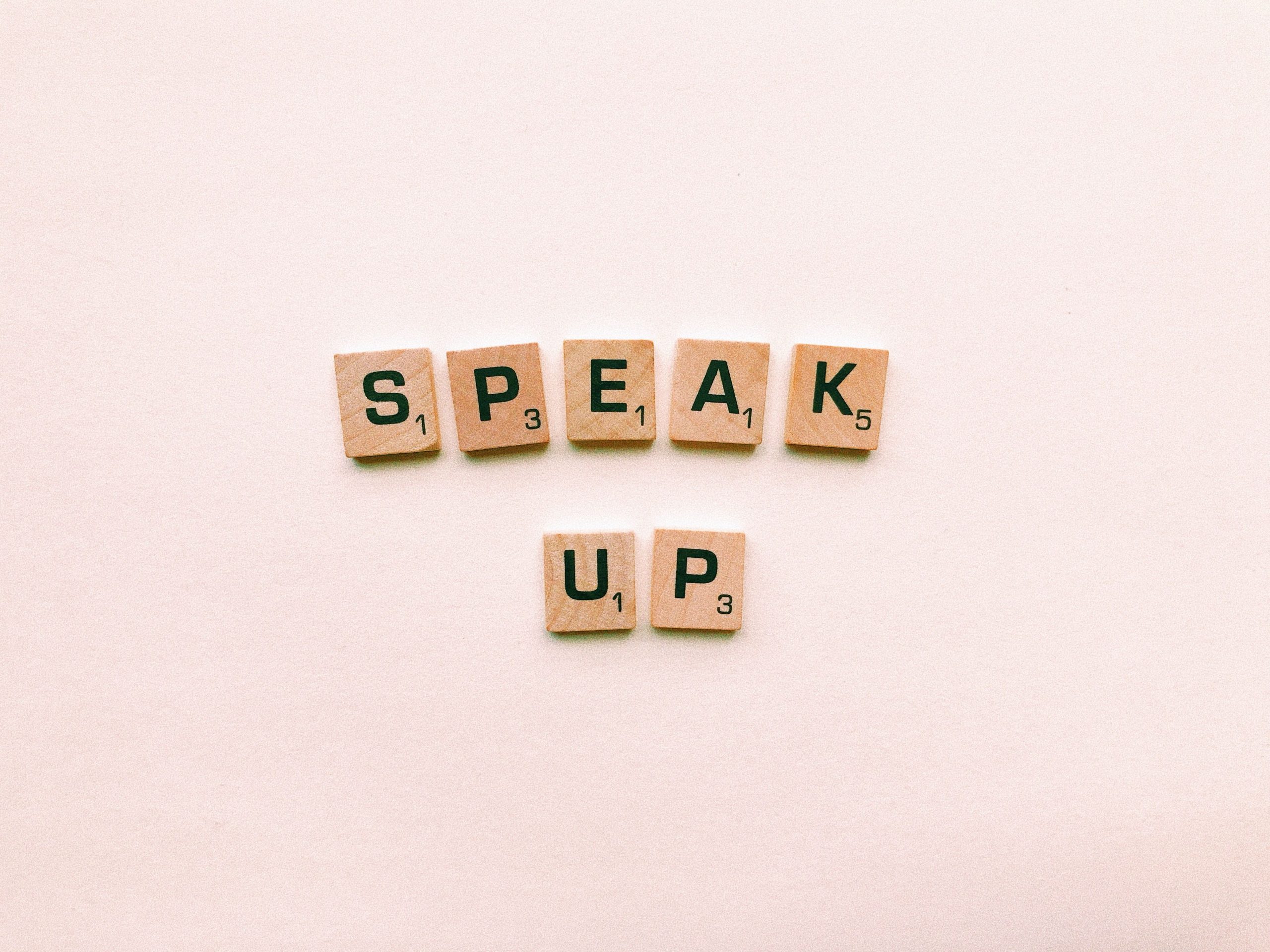 speak up trivial pursuit letters against pink background